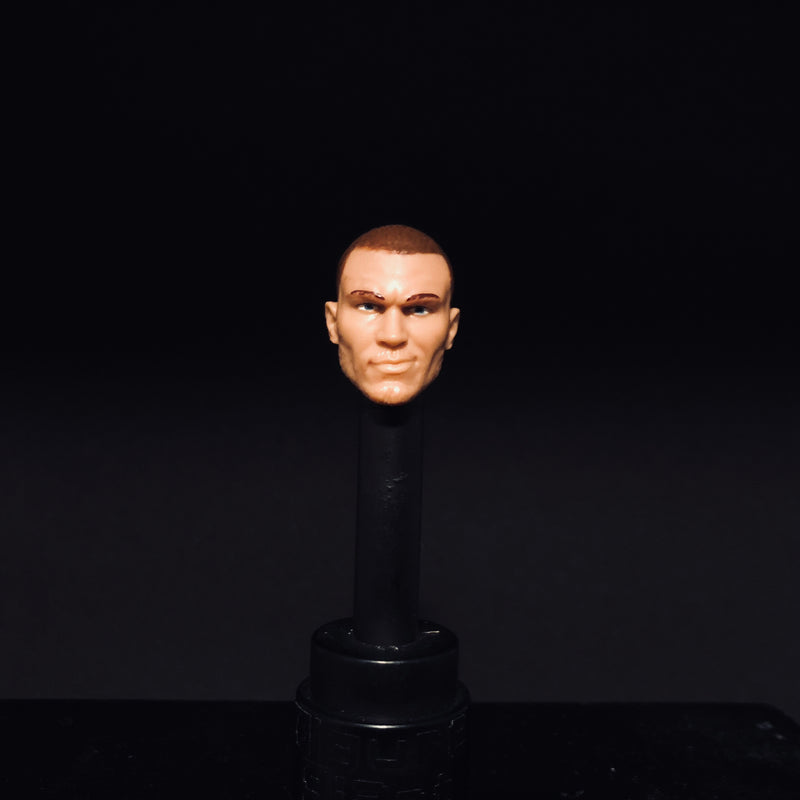 Randy Orton (shaved head with smirk)