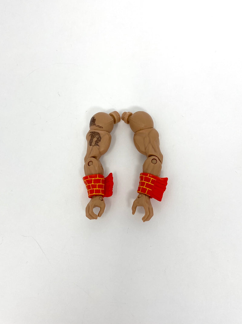 Arms with orange/yellow wrist accessory (Ultimate Warrior)